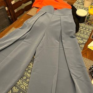 Milly light blue flare trousers with front pleats. Size 8.